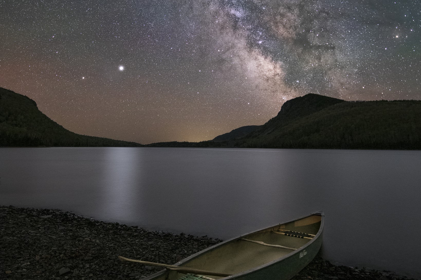 stary night and a kayak