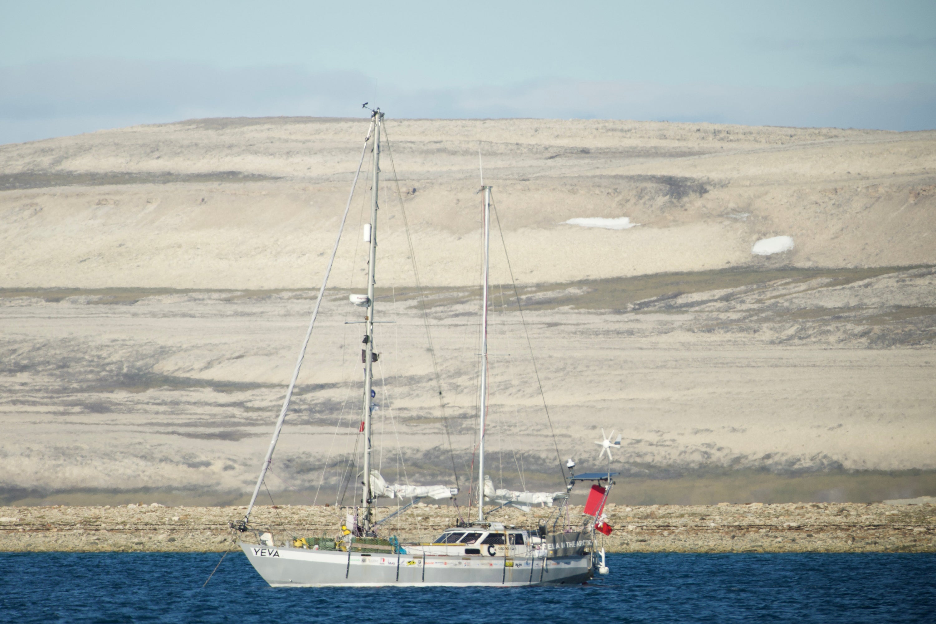 Ella's sailboat, Yeva, anchored off the coast of Greenland where she needed to get repairs after encountering a storm