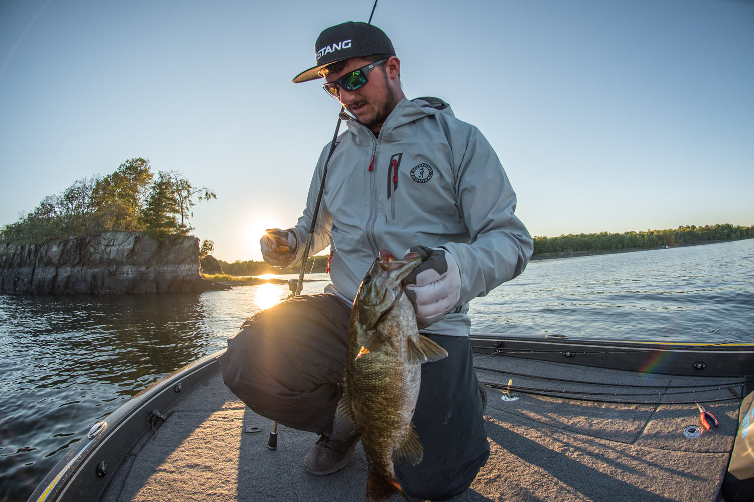Mustang Survival Men's Callan waterproof jacket used on fishing boat on water while catching fish